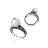 Elegant Balinese silver ring with white freshwater pearl and artisan scroll design.